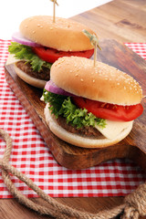 Delicious fresh homemade burger on a wooden table