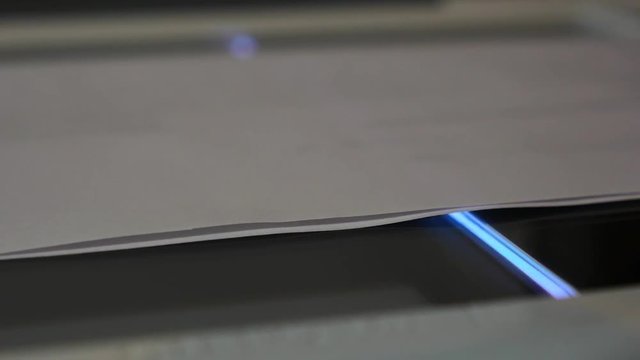 Close up of a document being scanned