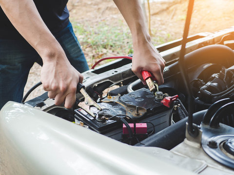 Charging Car Battery With Electricity Trough Jumper Cables