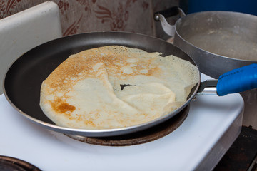 Pancake dough in the frying pan