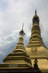 Fototapeta premium THE GLITTERING PAGODA The sky scene of golden Pagoda in the center city of Yangon. The pagoda was built with gold.