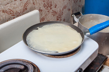 Pancake dough in the frying pan