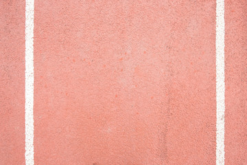 surface of the red running track in the stadium on top view for copy space emtry background.