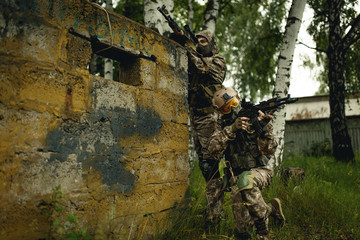 Fototapeta premium Photo of soldiers with gun