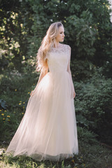 Fototapeta na wymiar Portrait of Young Beautiful Attractive Bride with Flowers. White Wedding Dress