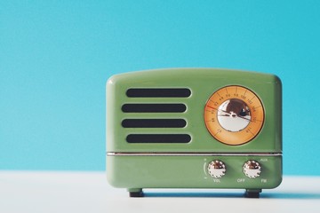 Vintage radio over blue color background,copy space 