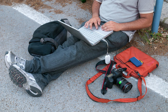 photo journalist sends file to the agency