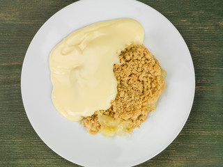 Apple Crumble Dessert Served With Hot Custard