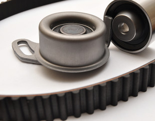 Car belt set with rollers on a light background