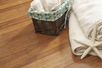 beach towels and a starfish on a wooden background