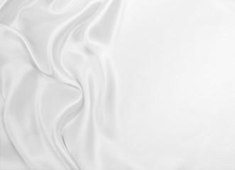 Naklejka premium Smooth elegant white silk or satin luxury cloth texture as wedding background. Luxurious background design