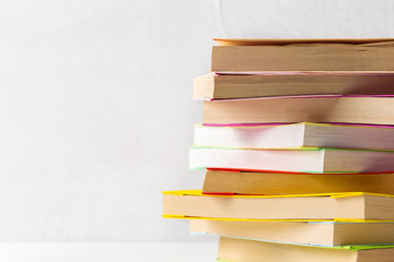  pile of paperback books on a table