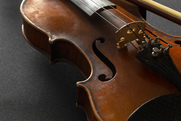 Fototapeta premium Old violin on a black background