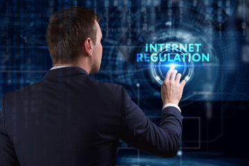 Business, Technology, Internet and network concept. Young businessman working on a virtual screen of the future and sees the inscription: Internet regulation