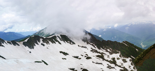 Mountain gorge and the top of the cloud overcast summer day.