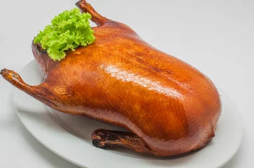 Wall murals Beijing Close-up roast peking duck (Whole Duck) on white plate and white background