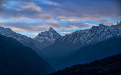 Fototapeta na wymiar Nandadevi Peak, the second-highest mountain in India as seen from Auli in Uttarakhand, India