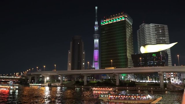 Tokyo, Japan - April 3, 2017: 4k b-roll cinematic footage of sunset blue hour scene at Tokyo city skyline overlooking the famous landmark, Tokyo Sky Tree and Sumida River Bridge