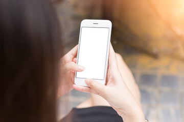 Close up young woman hands holding mobile smartphone isolated white screen for advertising display or mock up design