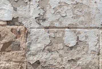 grey texture, old chipped plaster on the concrete wall, background