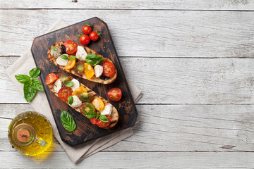 Bruschetta with tomatoes, mozzarella and basil