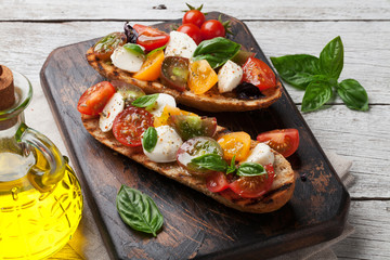 Bruschetta with tomatoes, mozzarella and basil