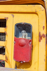 Damaged taillight of a old forklift truck closeup