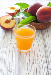 Ripe peaches and peach juice