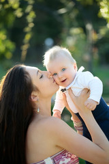 Happy cute baby boy and mother having fun