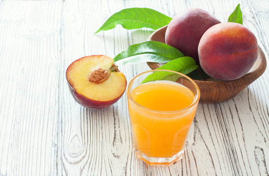 Ripe peaches and peach juice