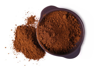 pile cocoa powder and porcelain bowl isolated on white background