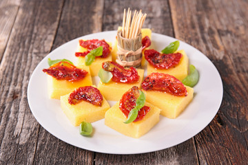 antipasto, polenta and dry tomato