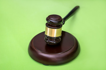 Law symbols  -  gavel isolated on green background