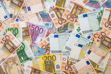 pile of euro banknotes as background - obrazy, fototapety, plakaty