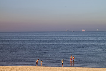 North Sea - beach walk with ships in the background