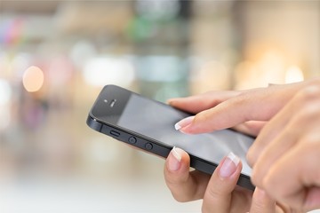 Hand holds phone.