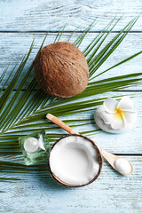 Set for spa treatment with coconut on wooden background