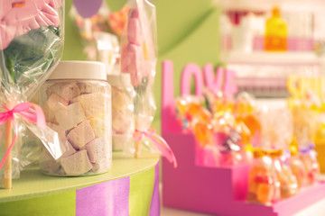 Jar with marshmallow on counter at candy shop