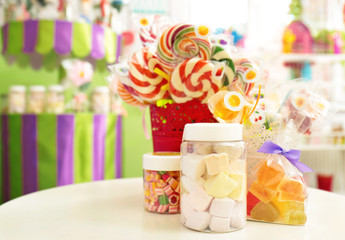 Fototapeta na wymiar Different sweets on table at candy shop