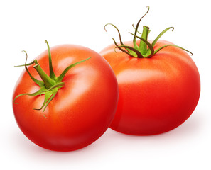 Two whole fresh red tomatoes with green leaves