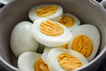 Tasty hard boiled eggs in bowl, closeup. Nutrition concept
