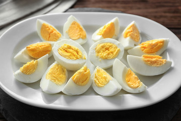 Hard boiled sliced eggs on plate. Nutrition concept