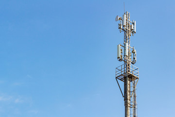 Telecommunication tower on a blue sky background with copyspace