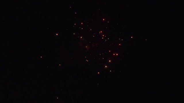 Multicolored beautiful firework salute. Multiple fireworks. Beautiful fireworks in night sky.