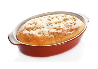 Baking dish with turkey pot pie on white background