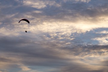 Paraglider flying in the air during colorful sunset. Slovakia