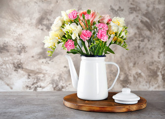 Obraz na płótnie Canvas Beautiful bouquet of fresh freesia in vase on table