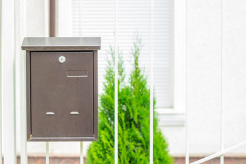 Obraz na płótnie Canvas Mailbox on old classic iron doors. Traditional metal letterbox