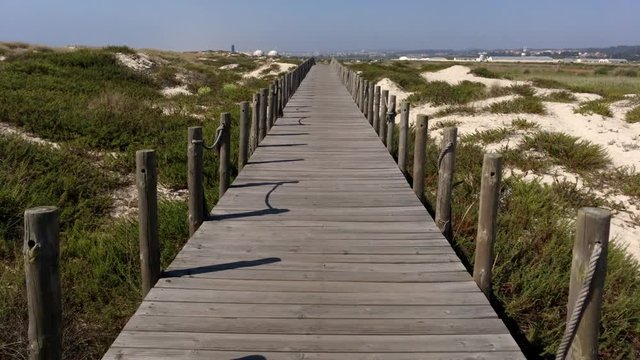 Point of view shot of riding a bicycle in Esmoriz, Ovar -  Portugal. Features a wide view of the bike track and the natural scenery as it travels.