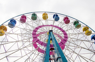Colorful ferris wheel in the city park.